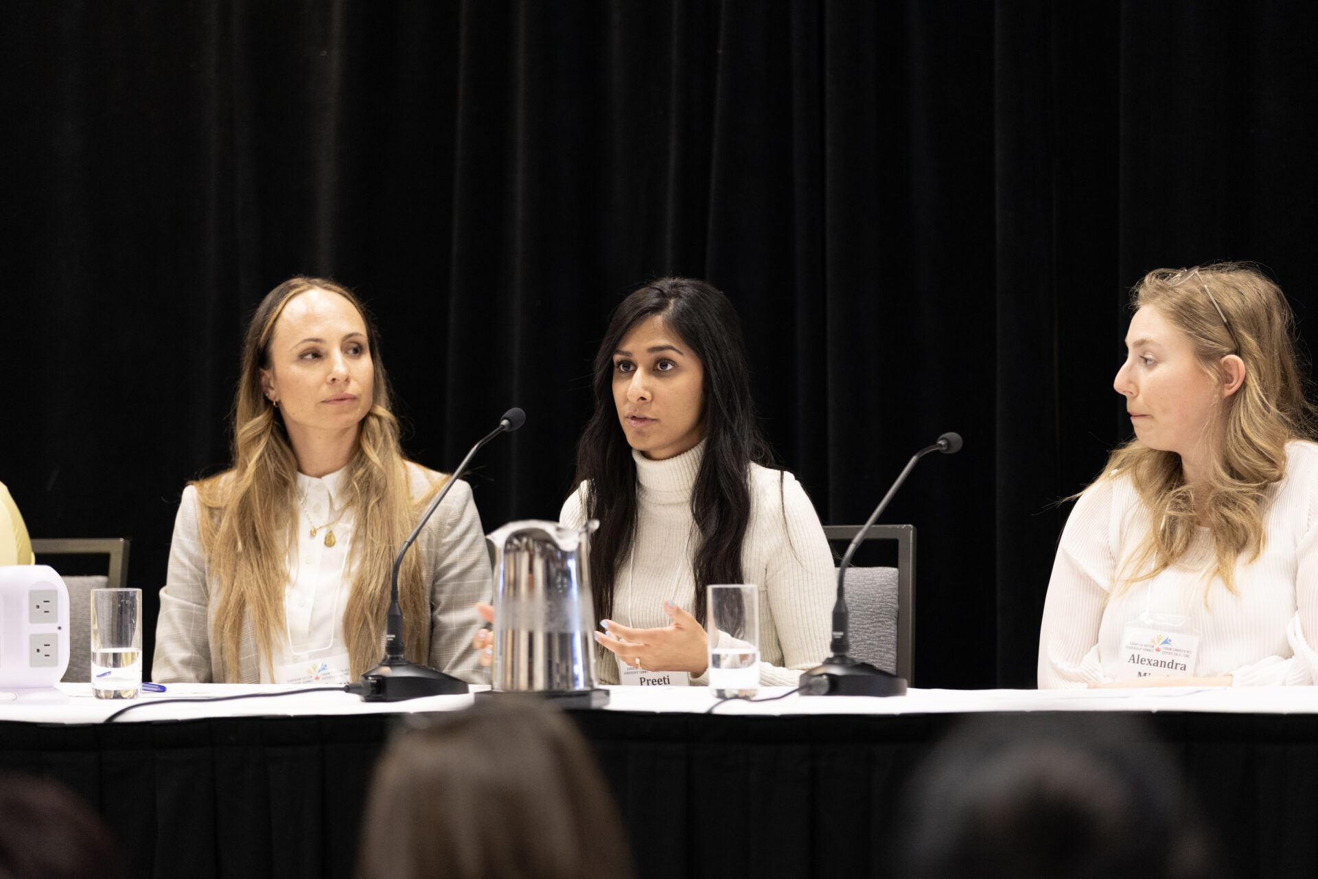 Three 2022 fellows speaking on a panel