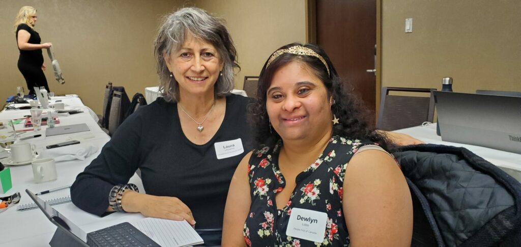 Two representatives people from from disability-focused organizations posing